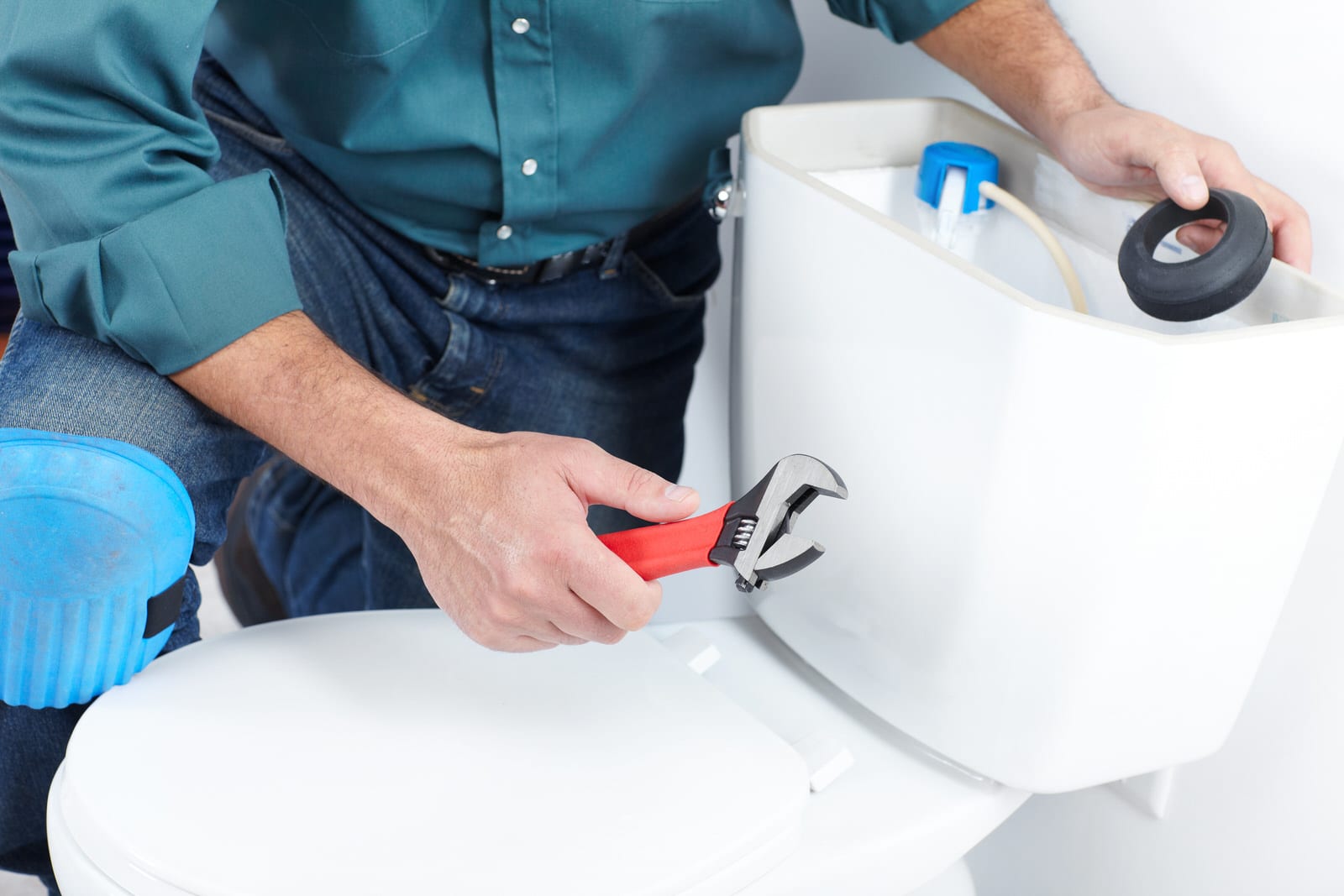 Plumber with a toilet plunger